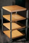 Sleek wooden shelving unit with metal supports for modern interior decor.