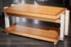 Elegant wooden TV stand with modern design from WoodYard, made of quality wood and white accents.