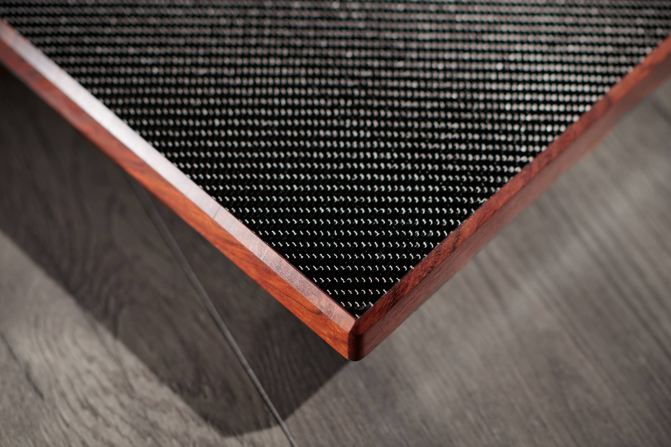 High-quality wooden furniture with a metal mesh tabletop for modern home decor.